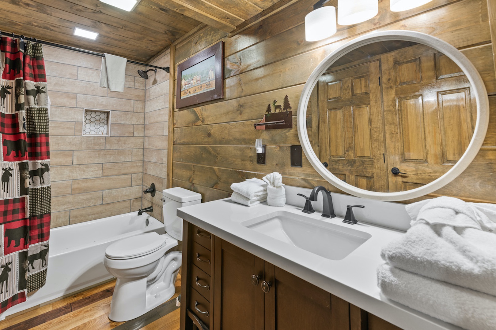 This second-floor full bath offers a single vanity & shower/tub combo