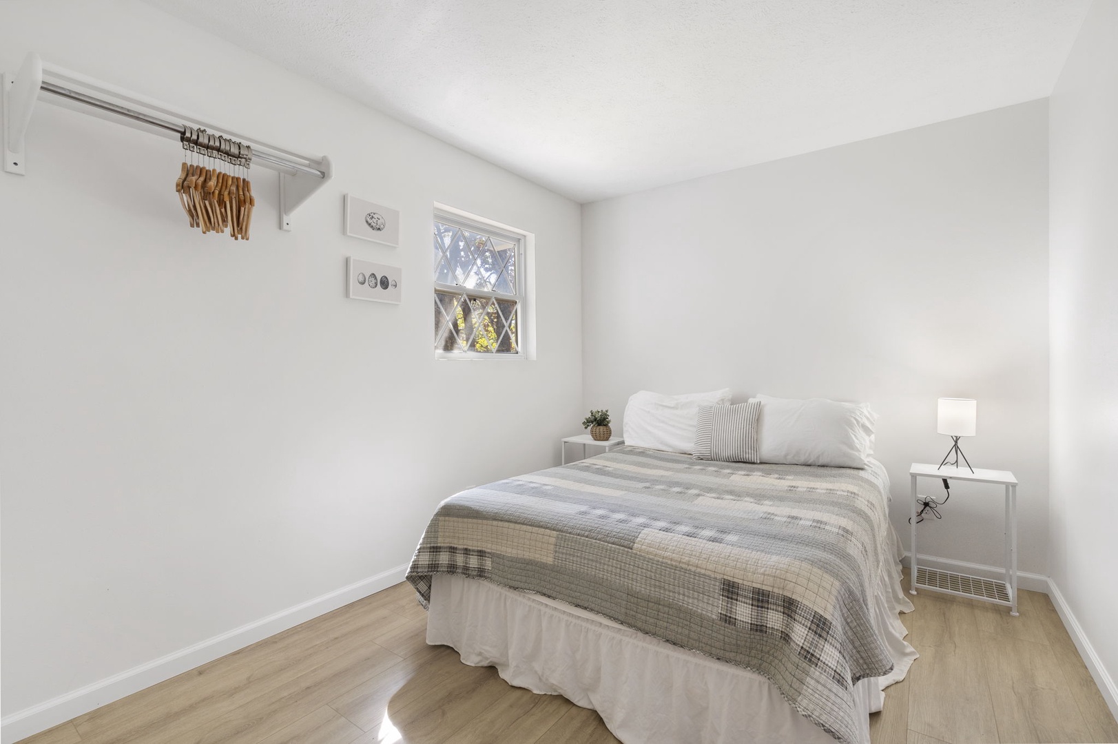 This 2nd floor bedroom offers a queen bed & lots of light