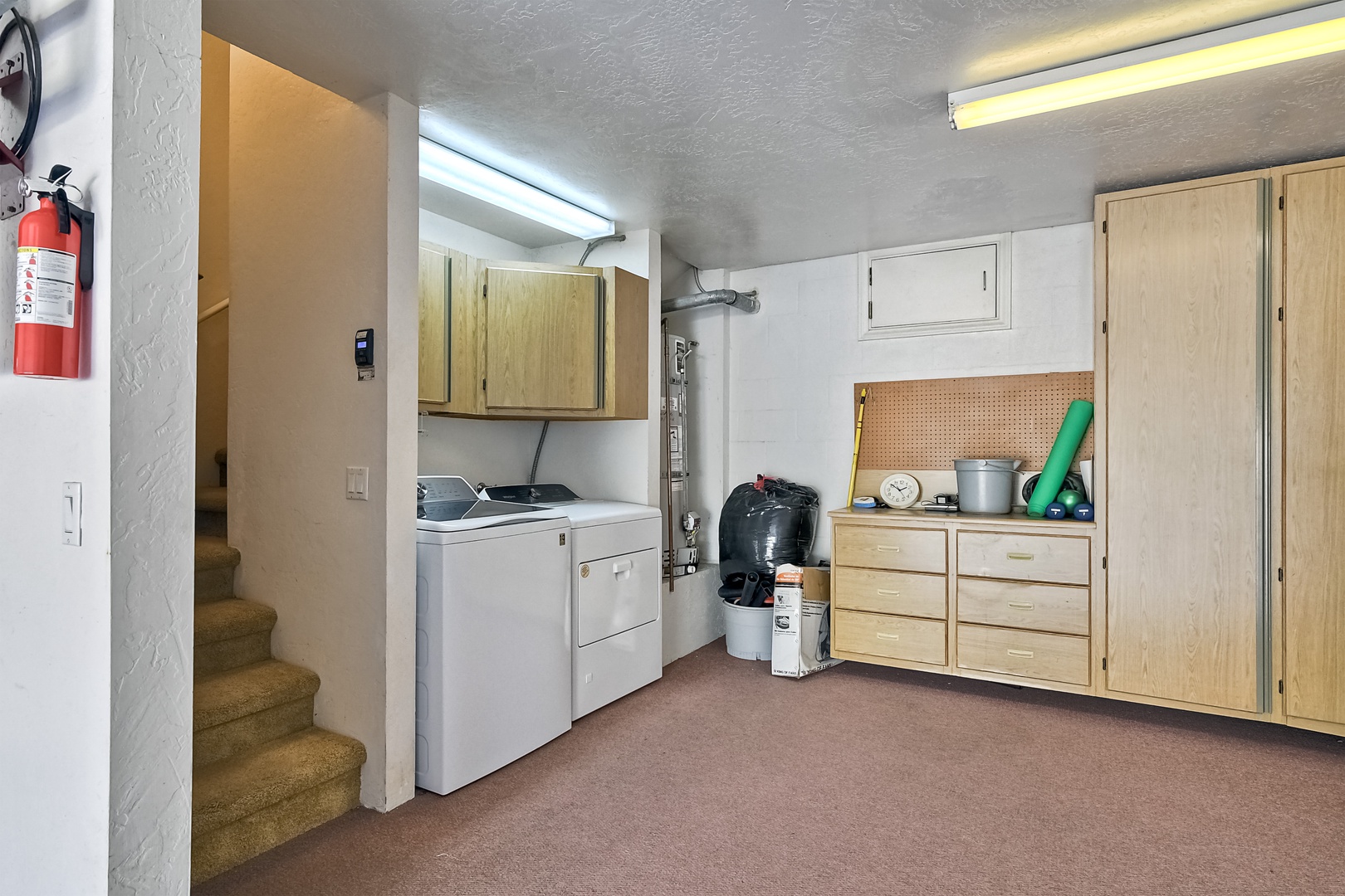 Private laundry is available for your stay, tucked away in the garage