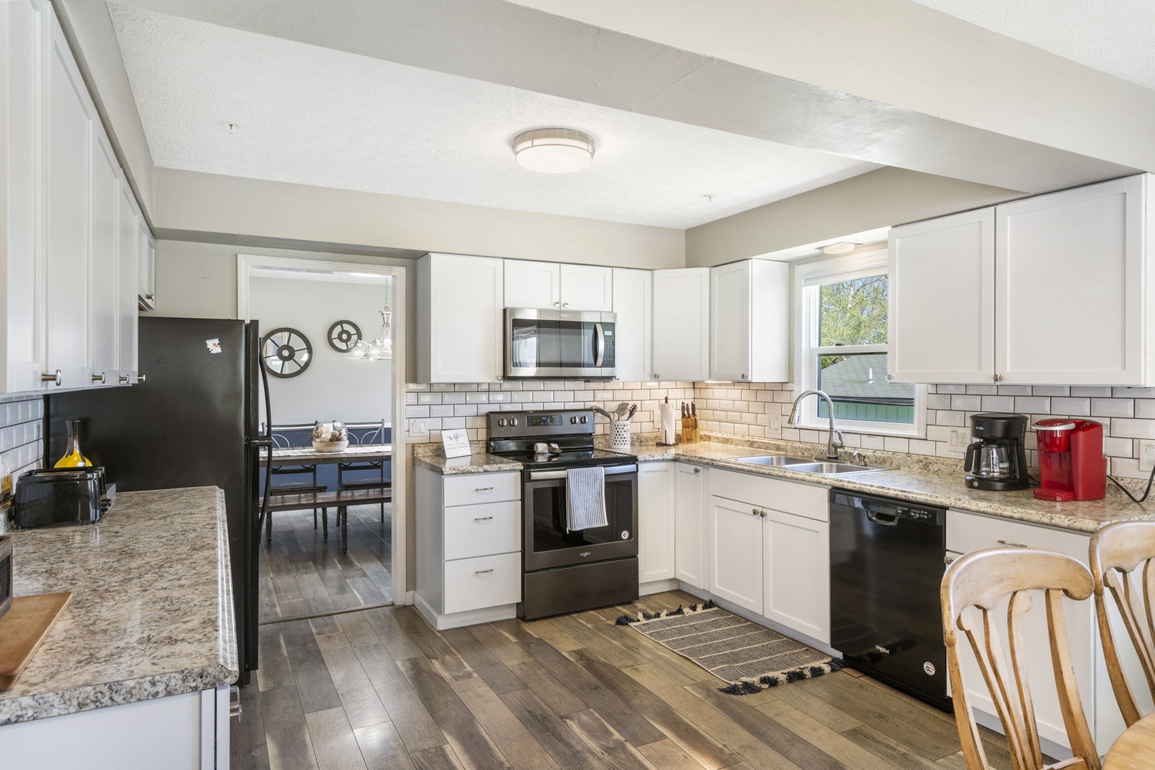 The spacious eat-in kitchen is well equipped with all the comforts of home