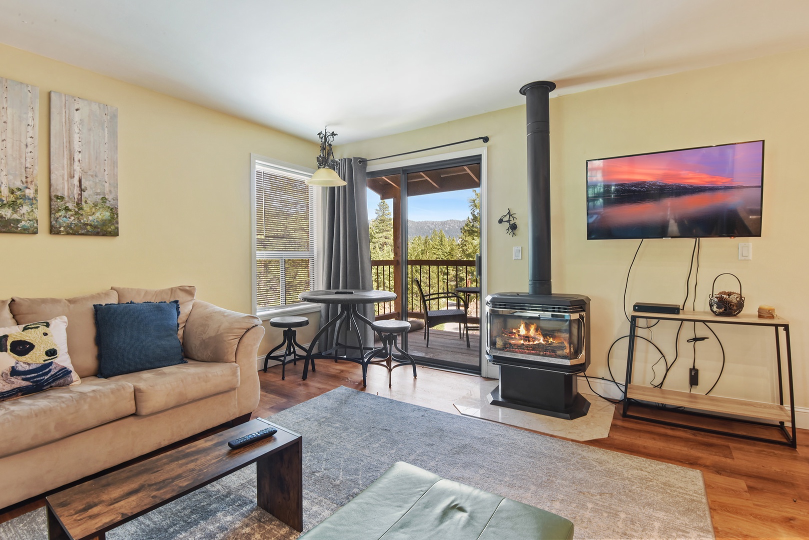 Relax & watch movies around the has fireplace