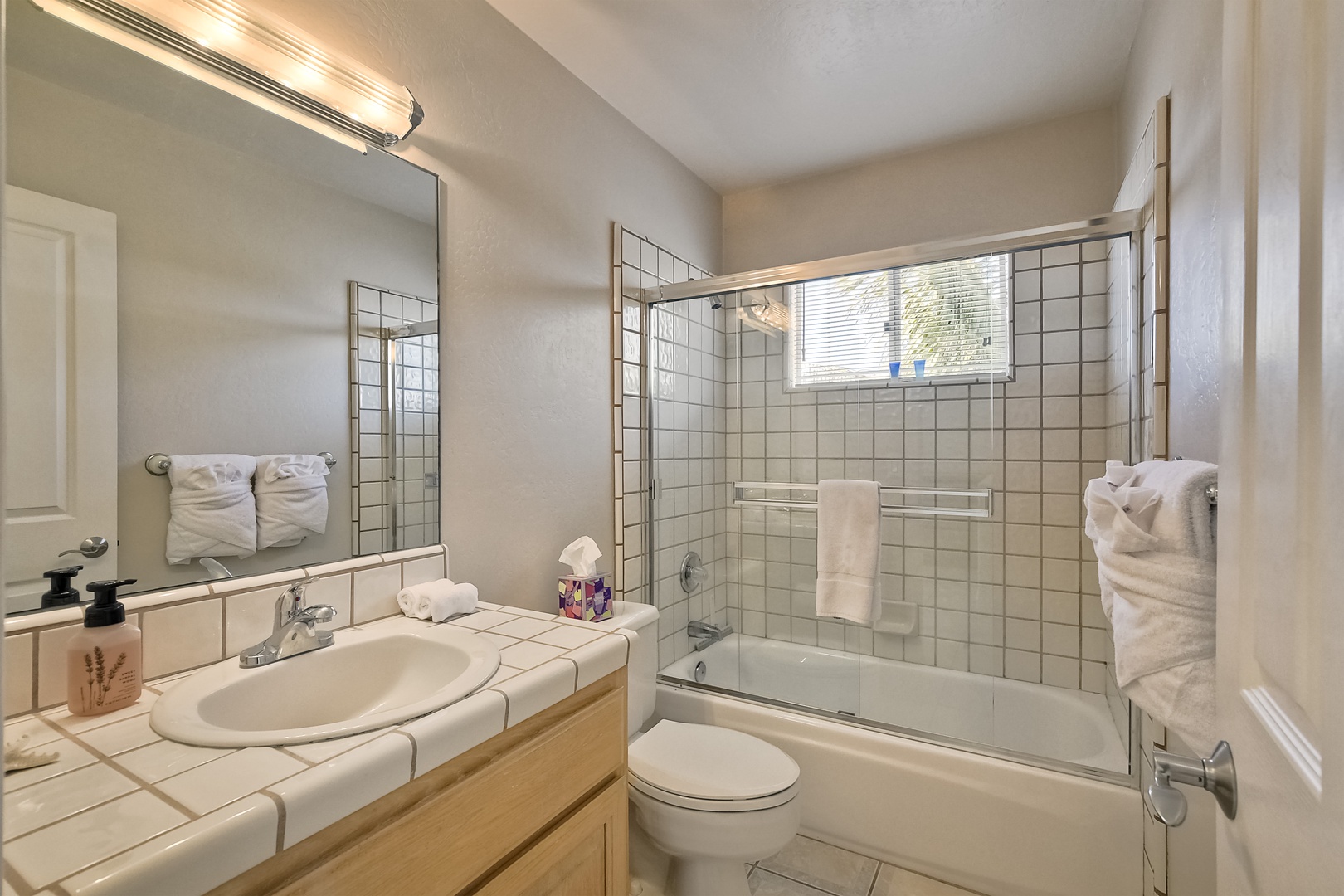 The second full bathroom offers a single vanity & shower/tub combo