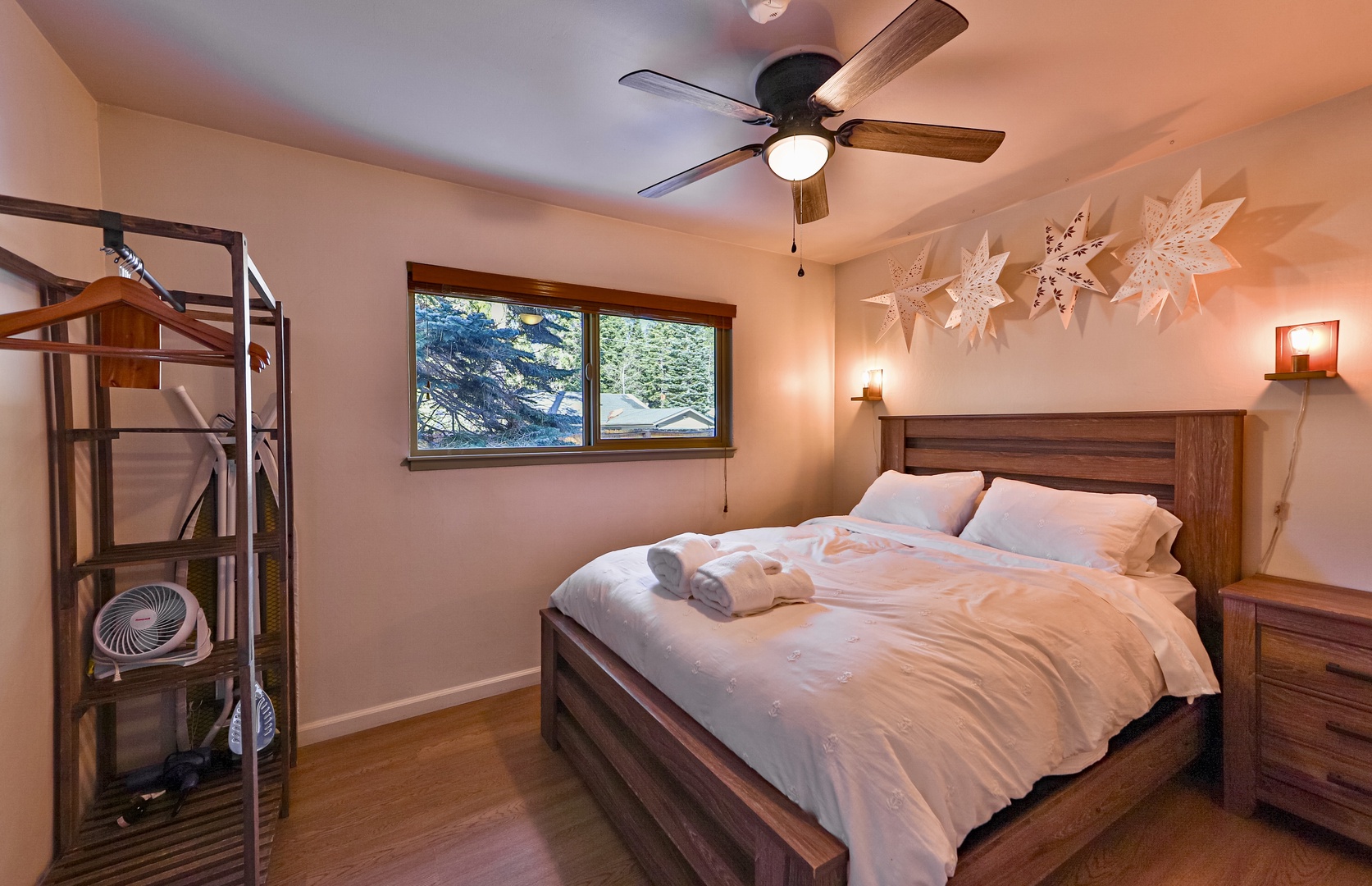 Recharge in this comfy queen bedroom with ceiling fan