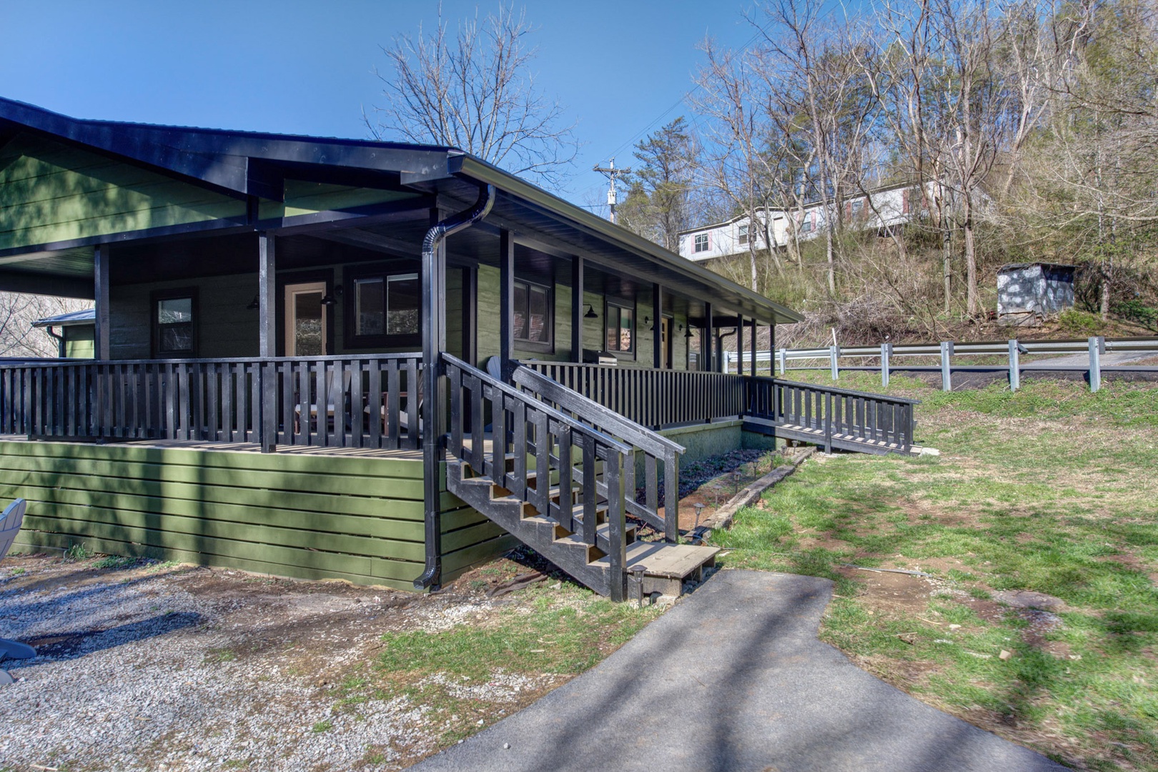 This charming cabin features a spacious deck, perfect for morning coffees and evening relaxation