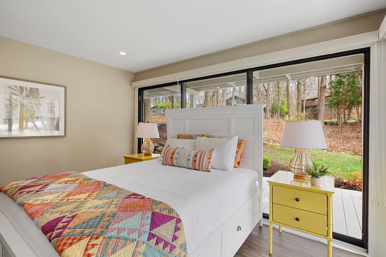 The second bedroom retreat includes a queen bed & deck access