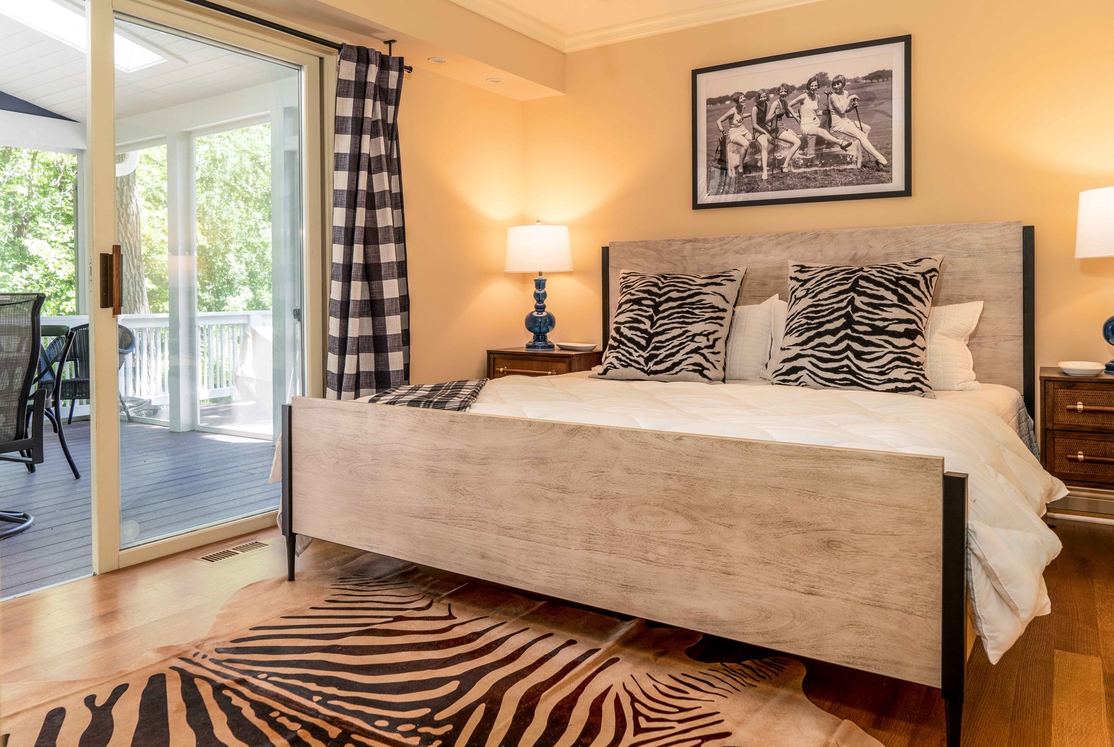 This spacious 1st floor bedroom offers a king bed & deck access