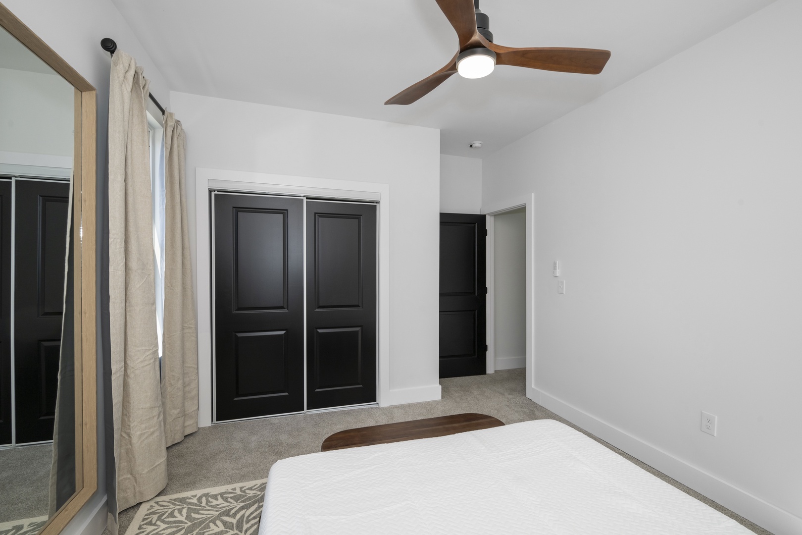 The final bedroom sanctuary includes a regal queen bed & ceiling fan