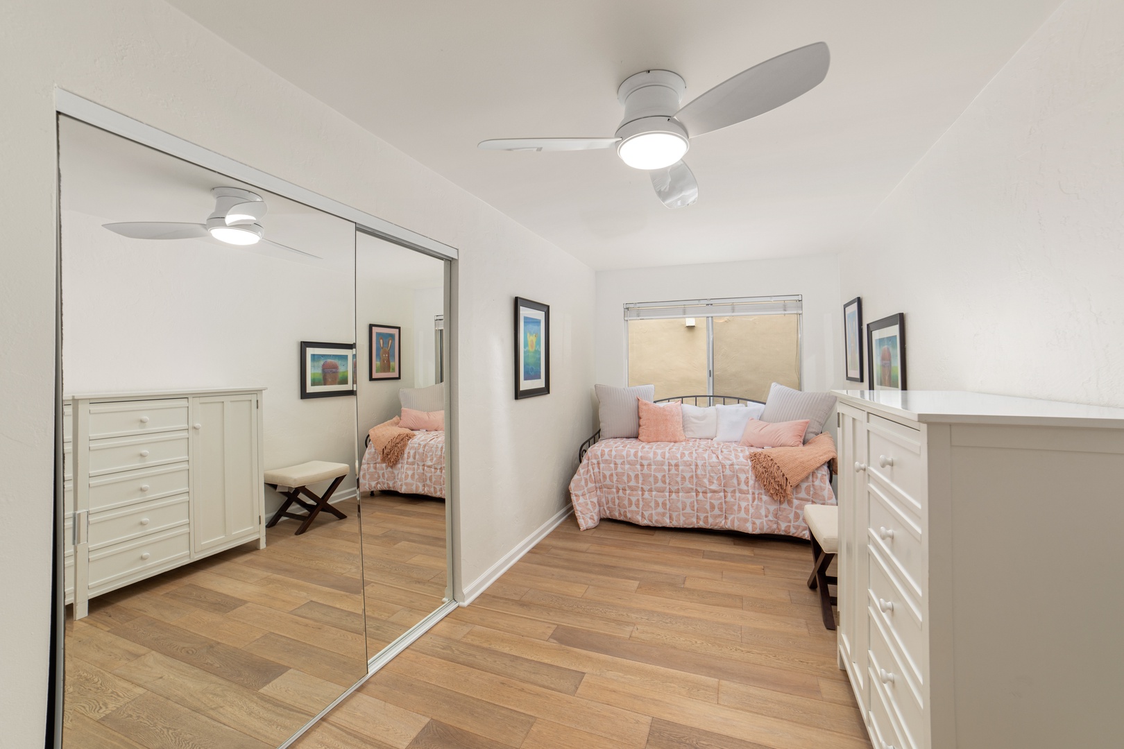 A plush full-sized daybed with a full trundle awaits in the first bedroom