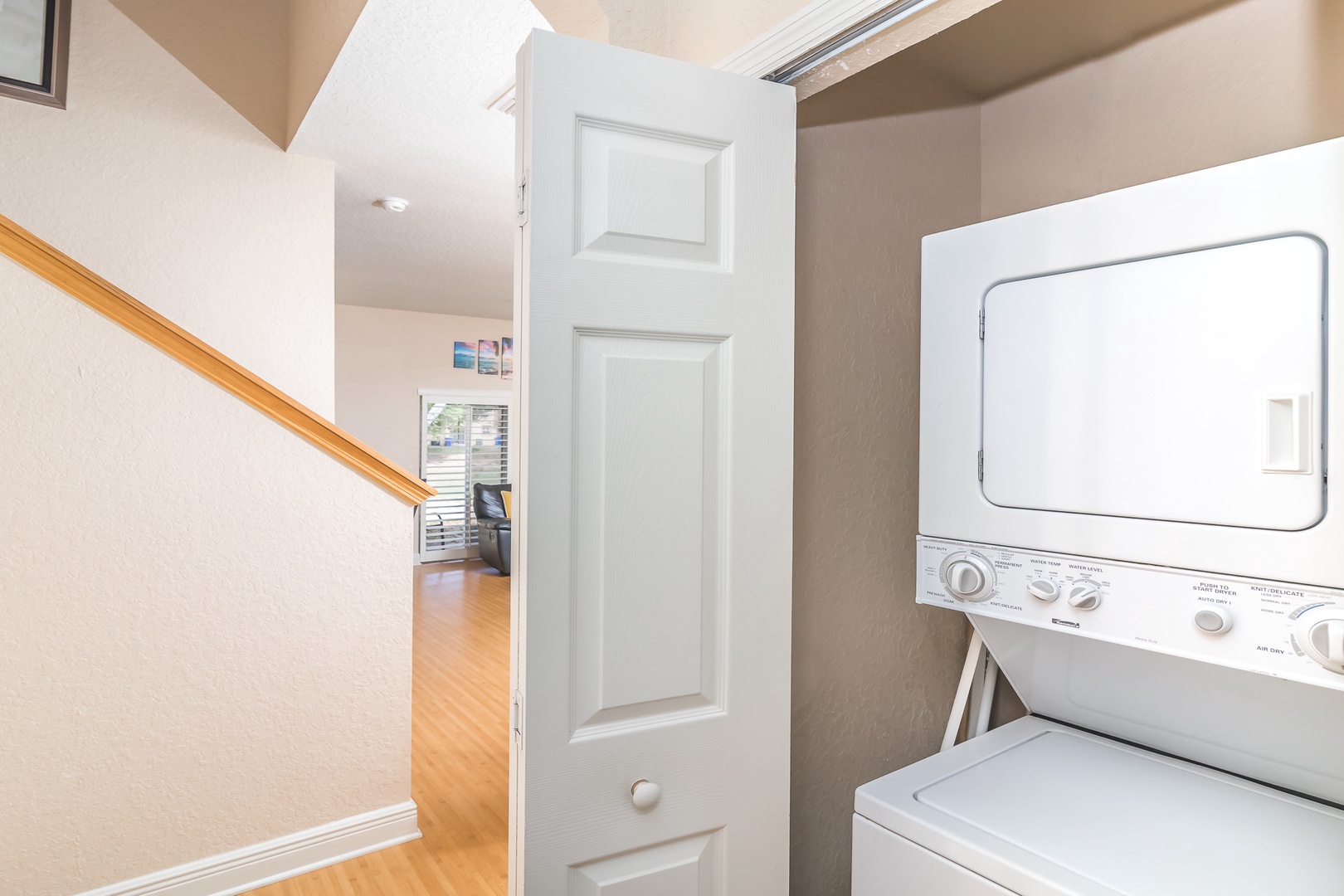 A laundry closet with a stackable washer and dryer is available for guest use