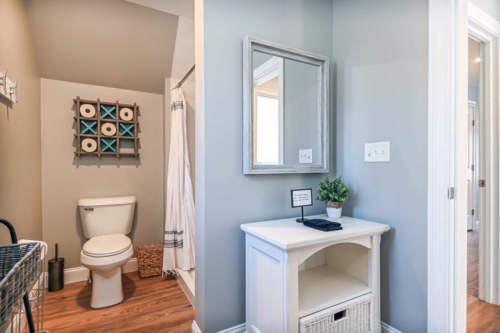 The upstairs full bath features a single vanity & walk-in shower