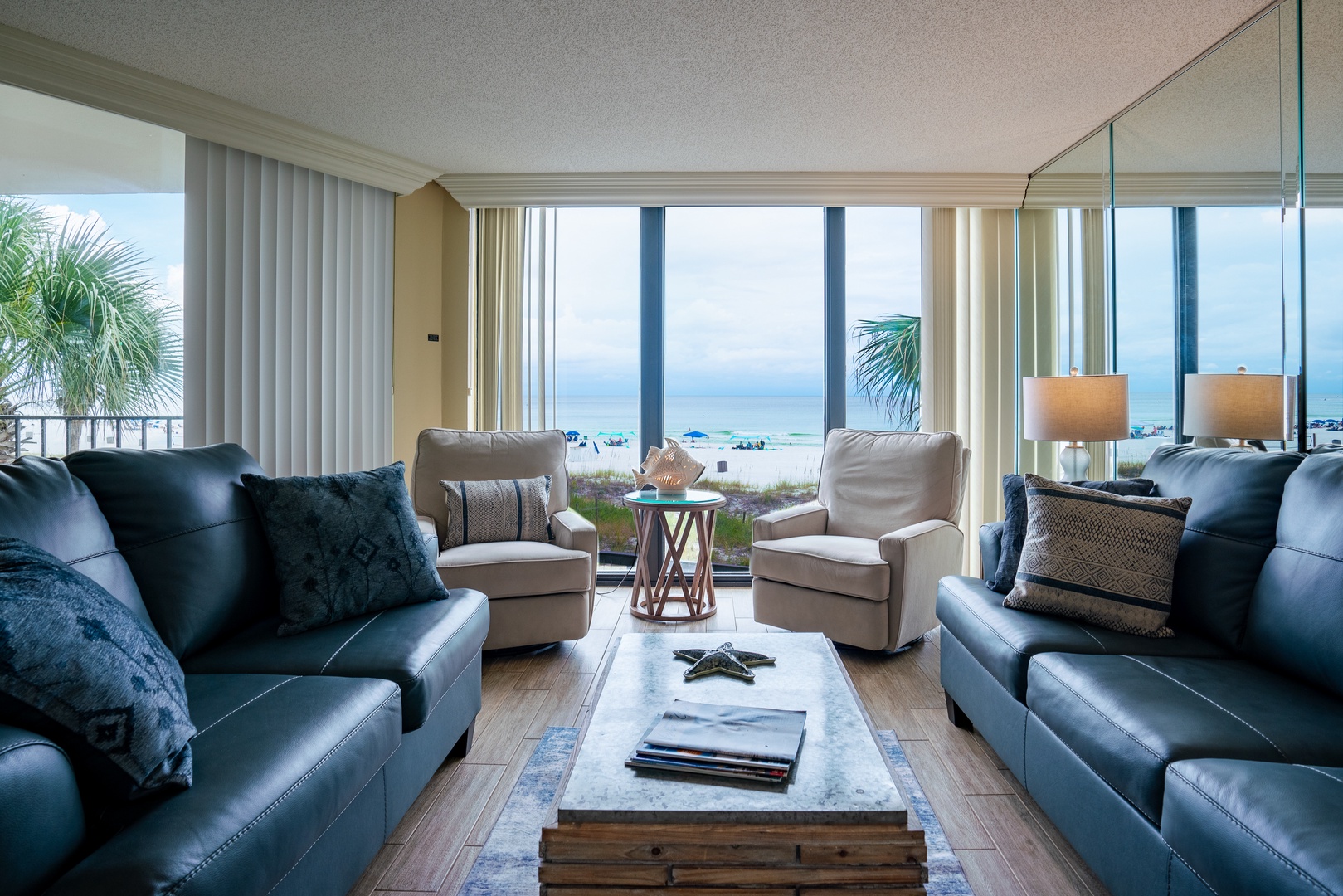 Living Room with doors that balcony and beautiful water views.