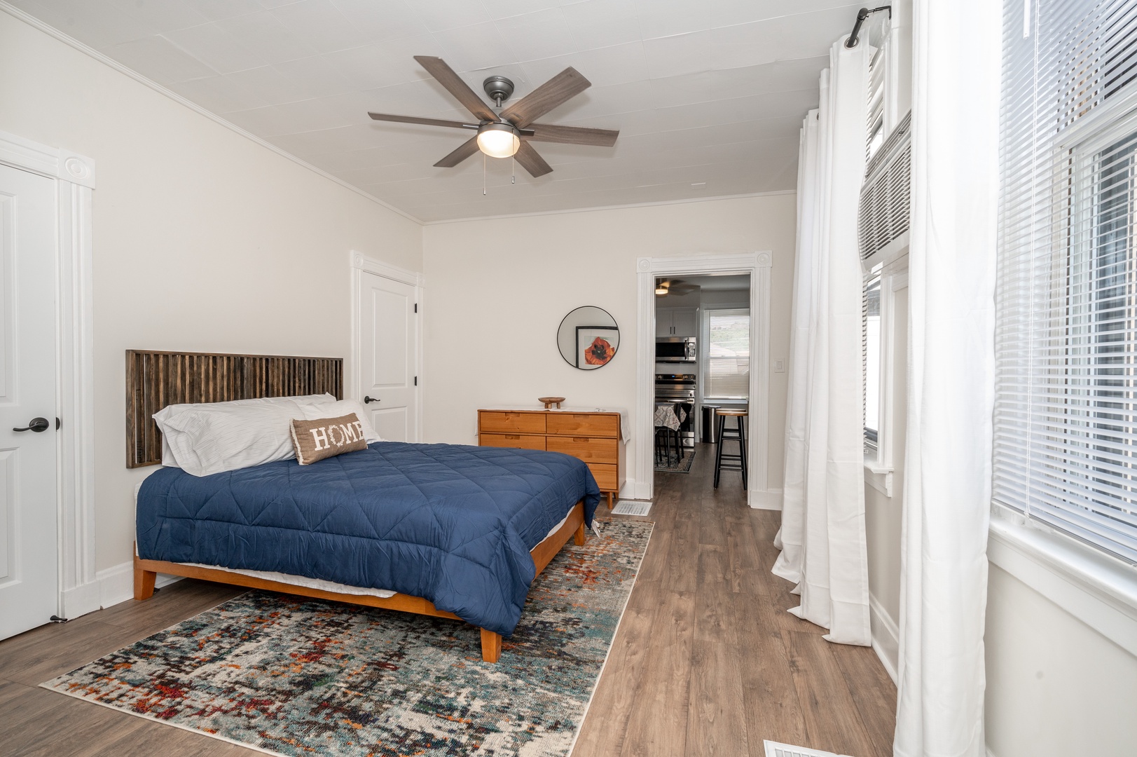 A plush queen-sized bed awaits in Apartment A’s bedroom retreat