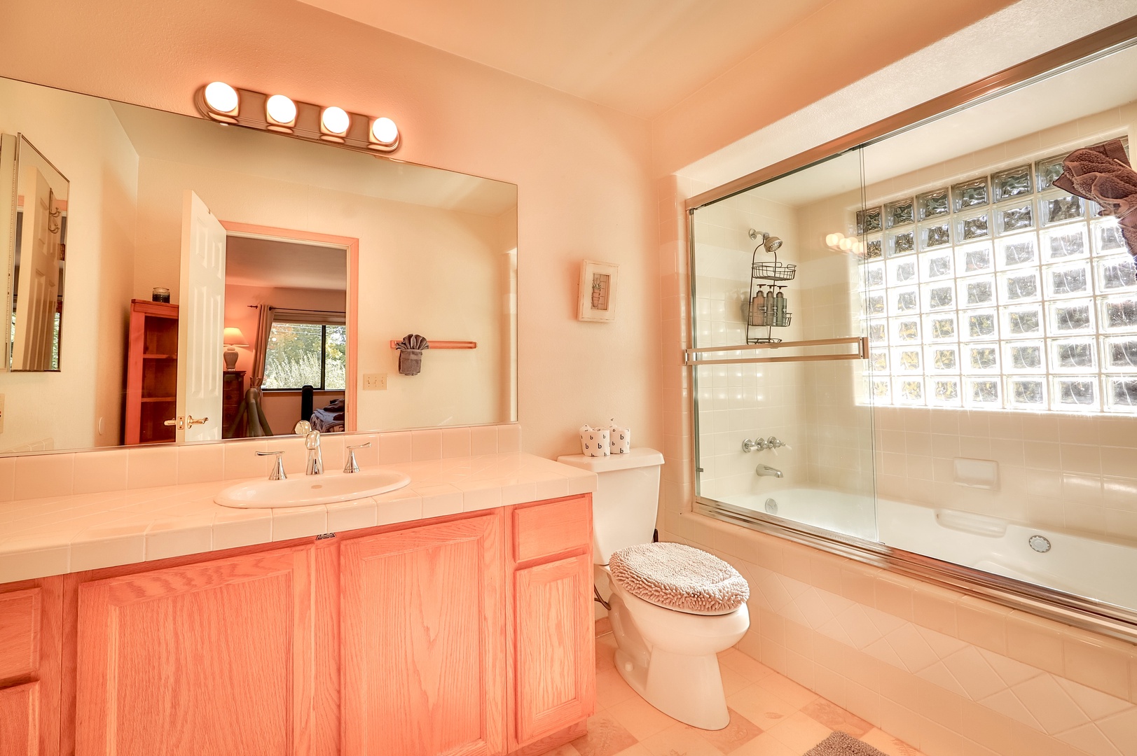 The ensuite bathroom offers a shower/tub combo