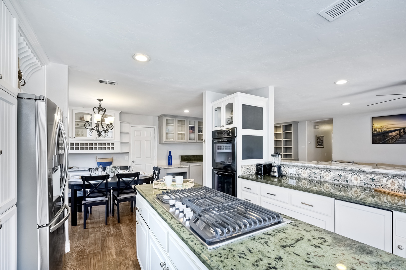 The open, modern kitchen offers ample space & all the comforts of home