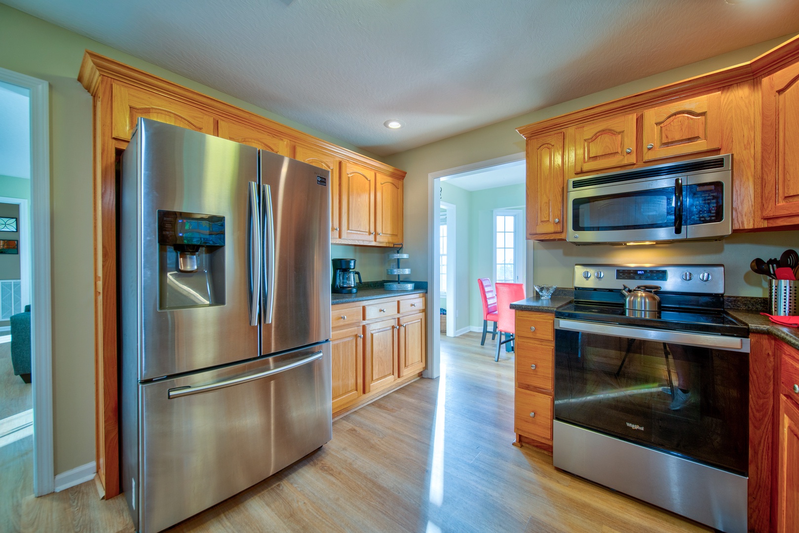 The kitchen is spacious & offers all the comforts of home