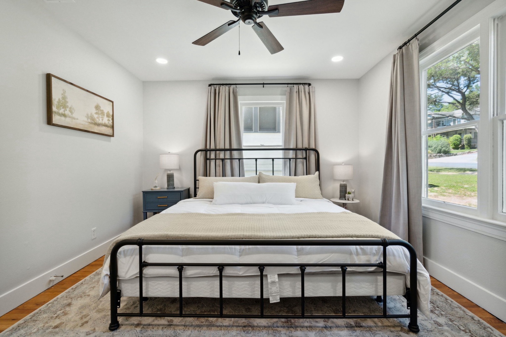 The second bedroom boasts a plush king-sized bed & Smart TV