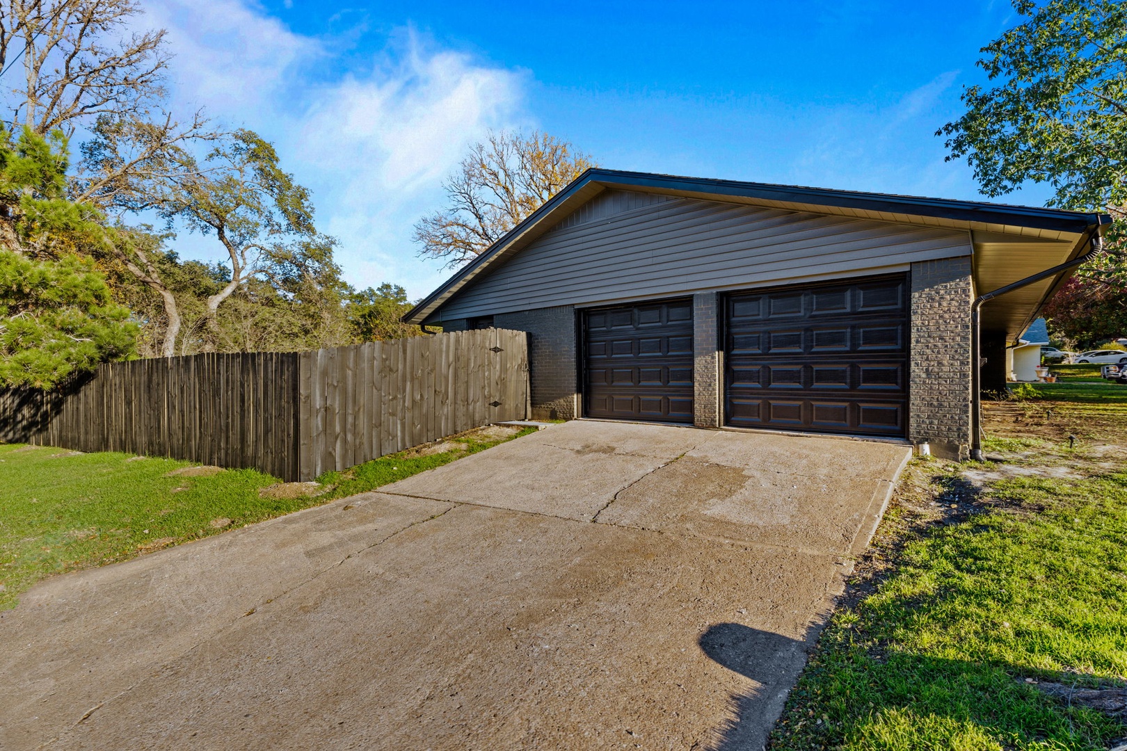 This home offers parking for up to 4 vehicles between the driveway & garage