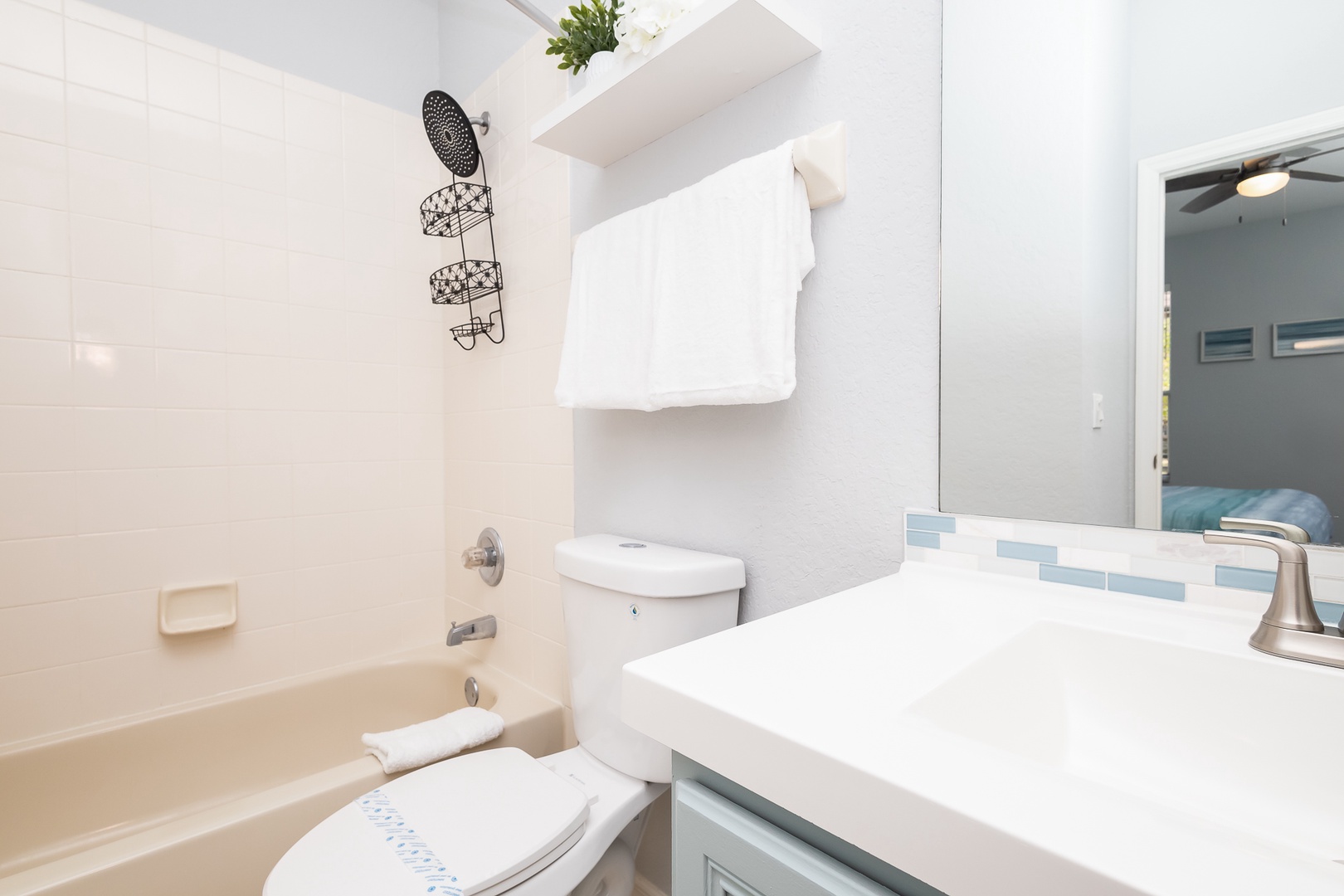 A single vanity & shower/tub combo await in the 1st-floor ensuite bath