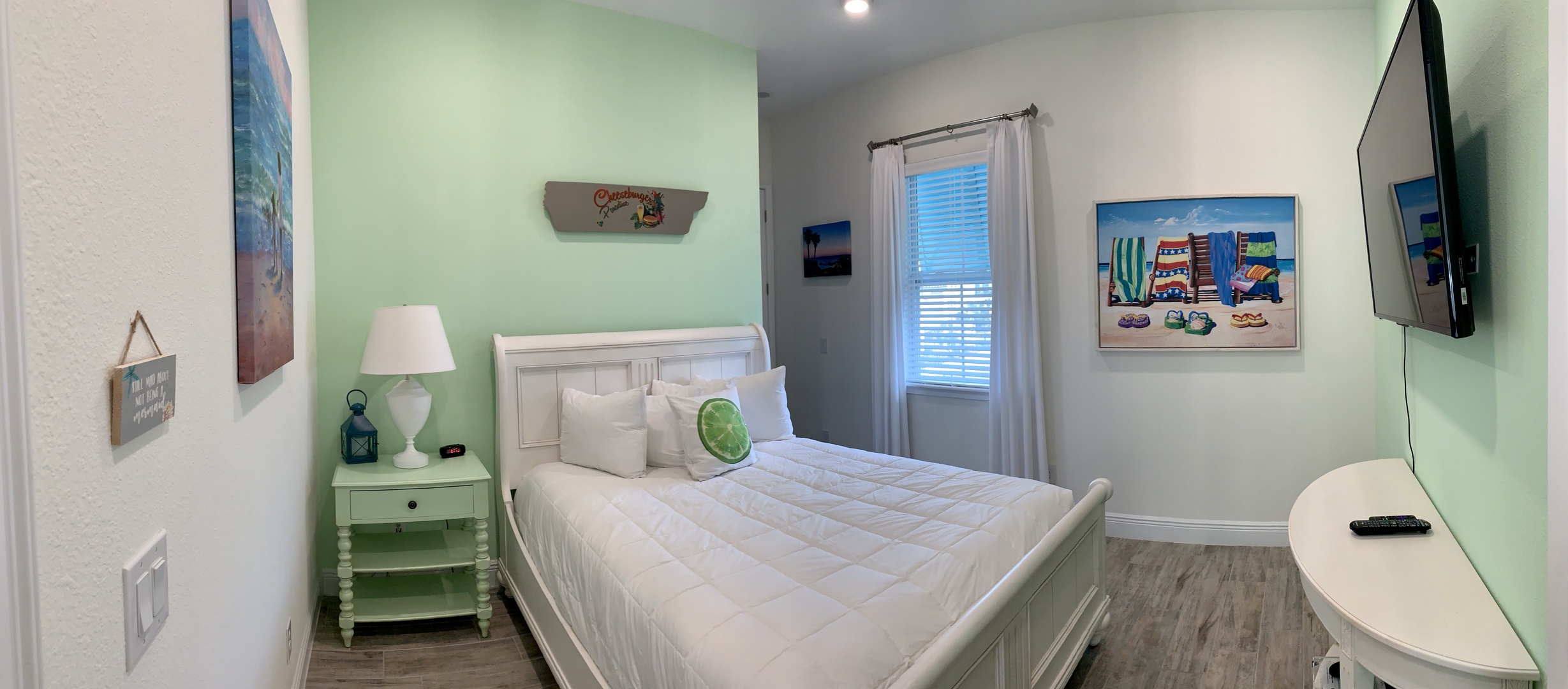 Bedroom 2 with Queen bed, TV, and en suite