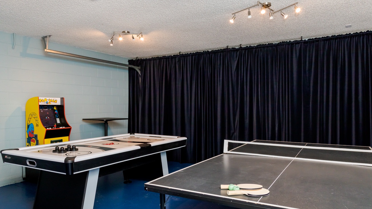 Enjoy air hockey, arcade game, and Ping Pong in the converted game room area!