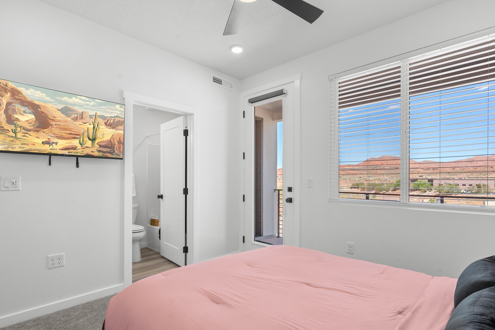 The final balcony suite features a cozy queen-sized bed, ensuite, & smart TV