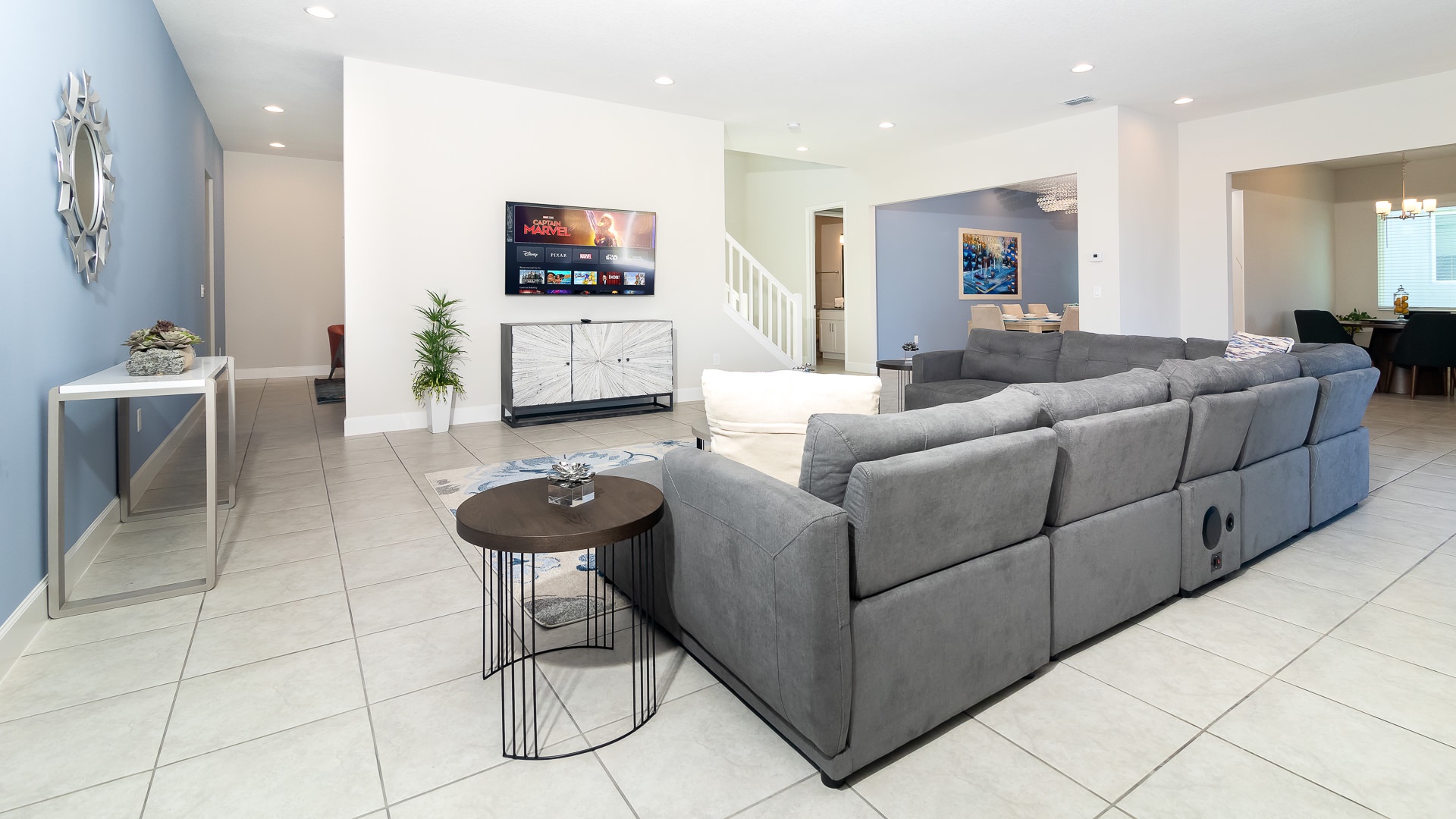 Plush sectional couch and a smart TV, perfect for lounging and catching up on your favorite shows