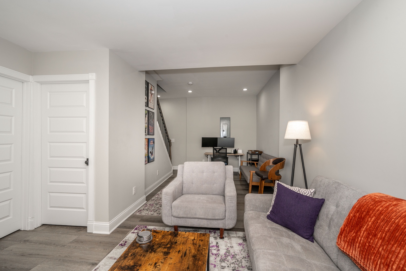Basement with sofa, TV, and work/study table