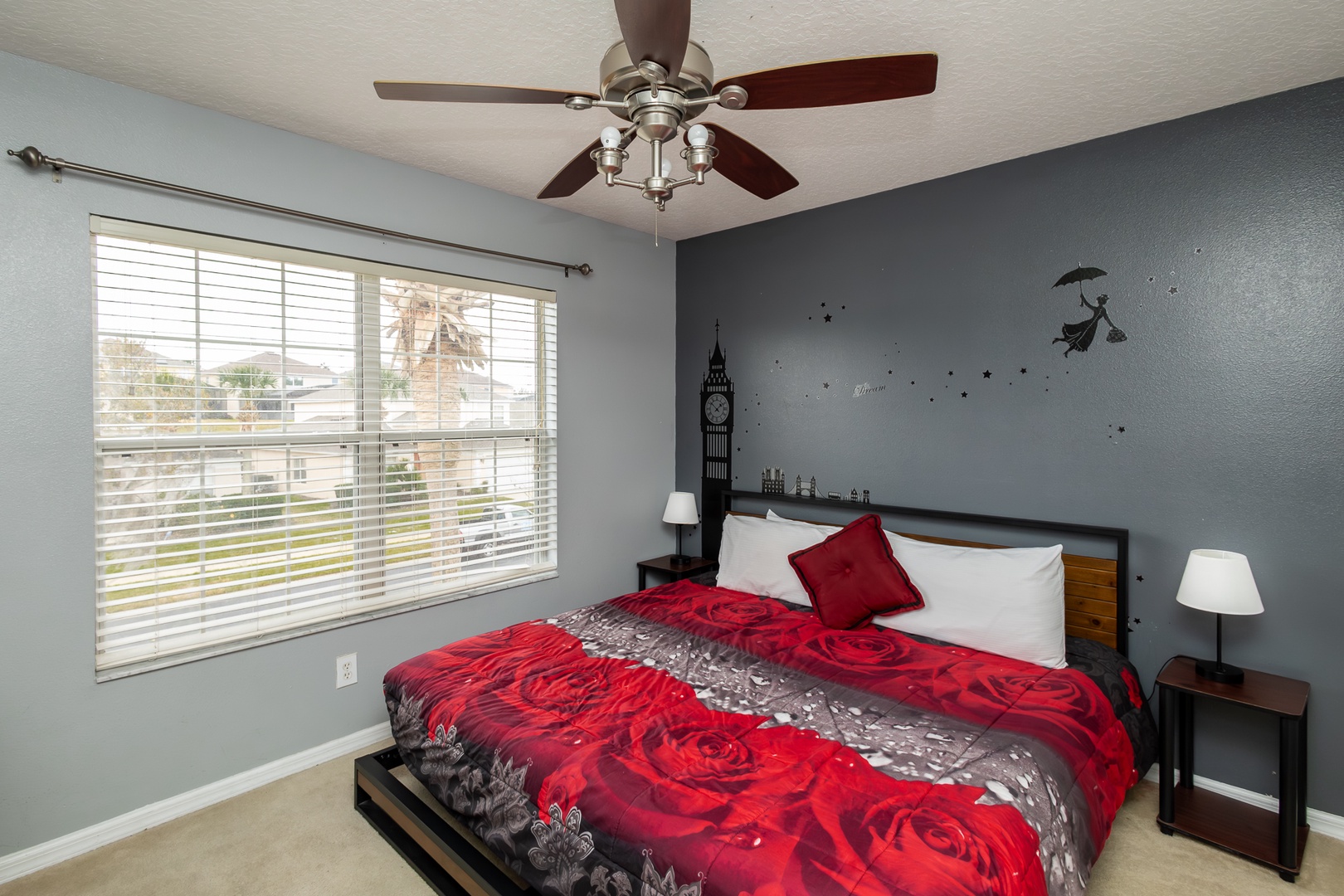 This 2nd King bedroom with a Peter Pan theme and a ceiling fan & smart TV