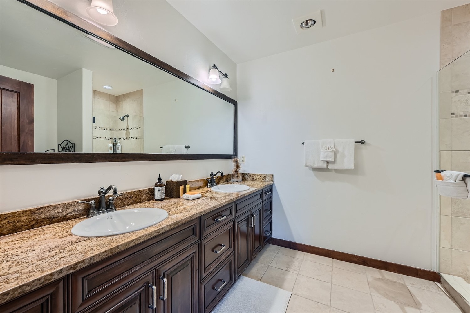 Enjoy an oversized vanity & shower in the final full bath