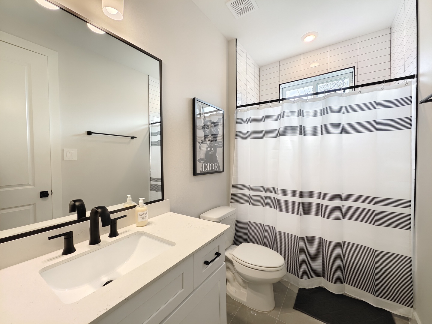A single vanity & shower/tub combo await in the 1st floor ensuite