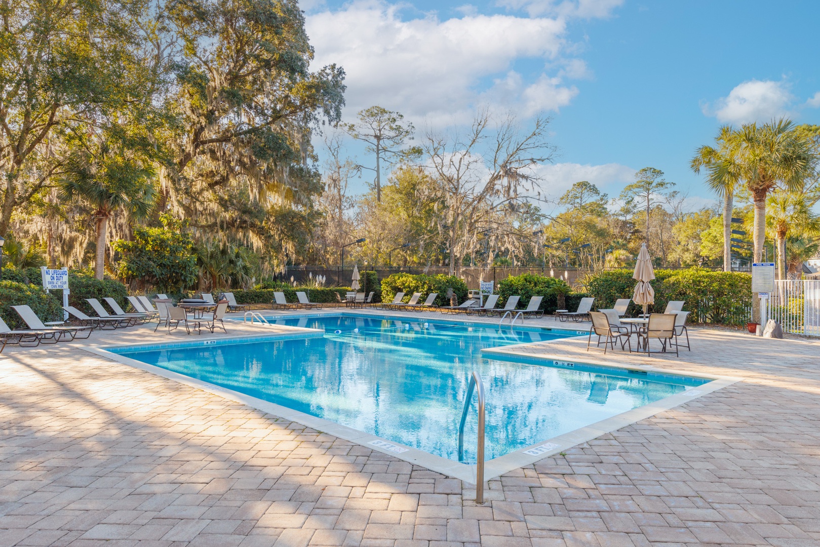 Retreat to the communal pool for an afternoon of relaxation