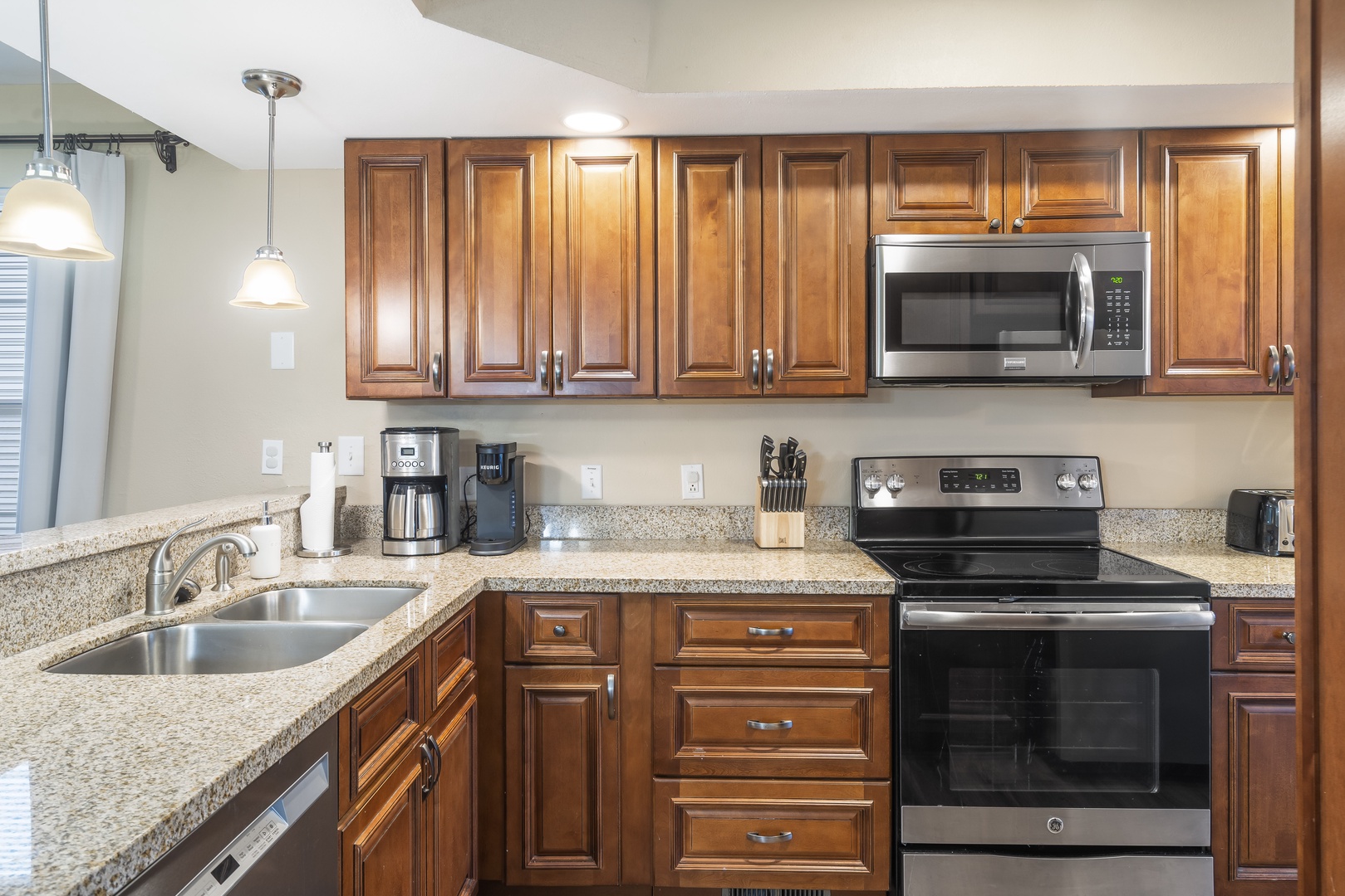 Kitchen features coffee pot and more!