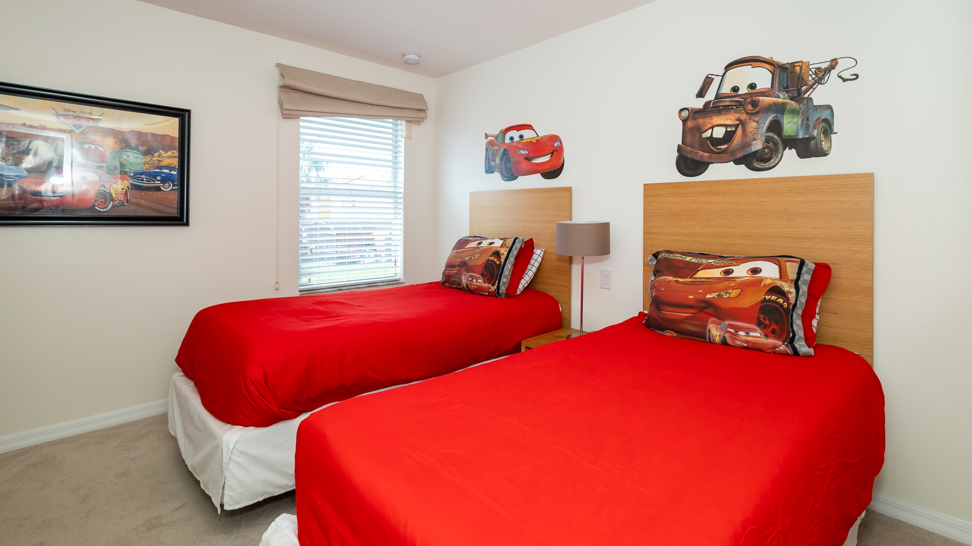 The second of two bedrooms offers a pair of twin beds, en suite, & Smart TV