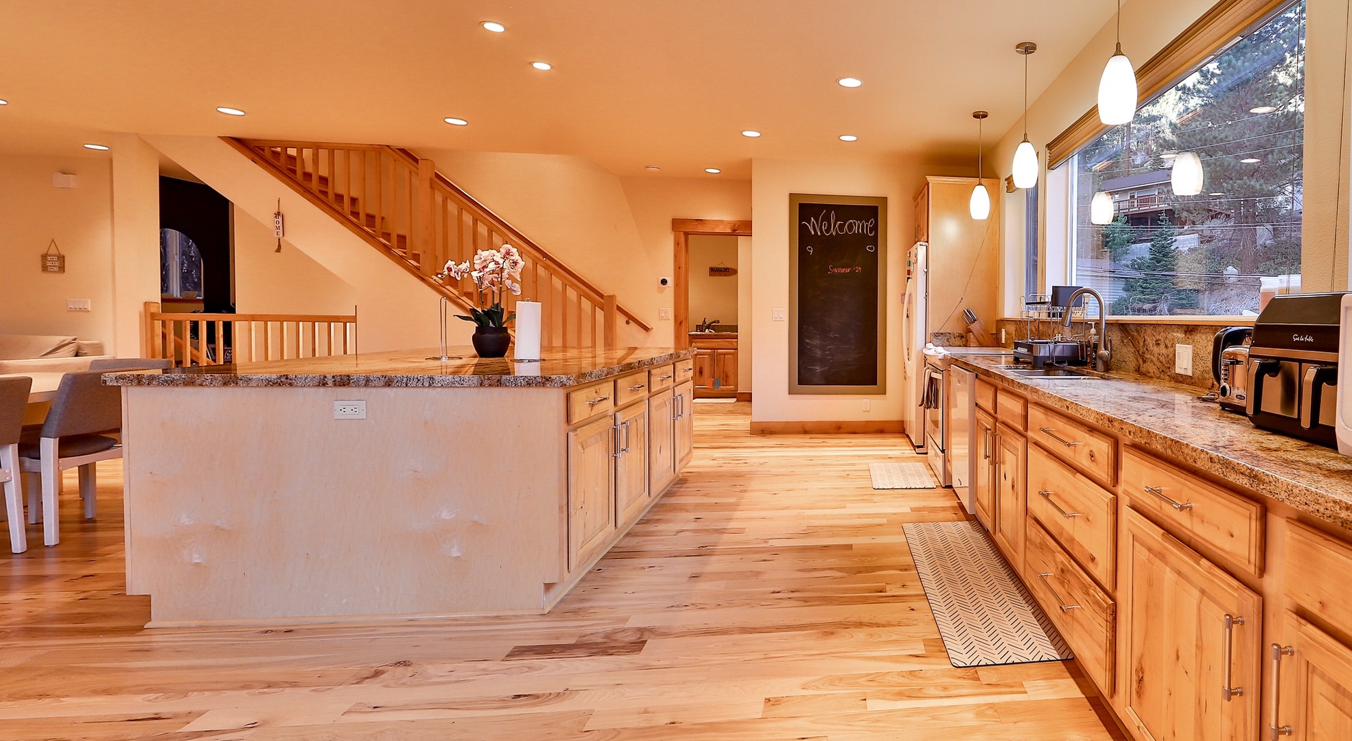 The open, airy kitchen offers ample space & all the comforts of home