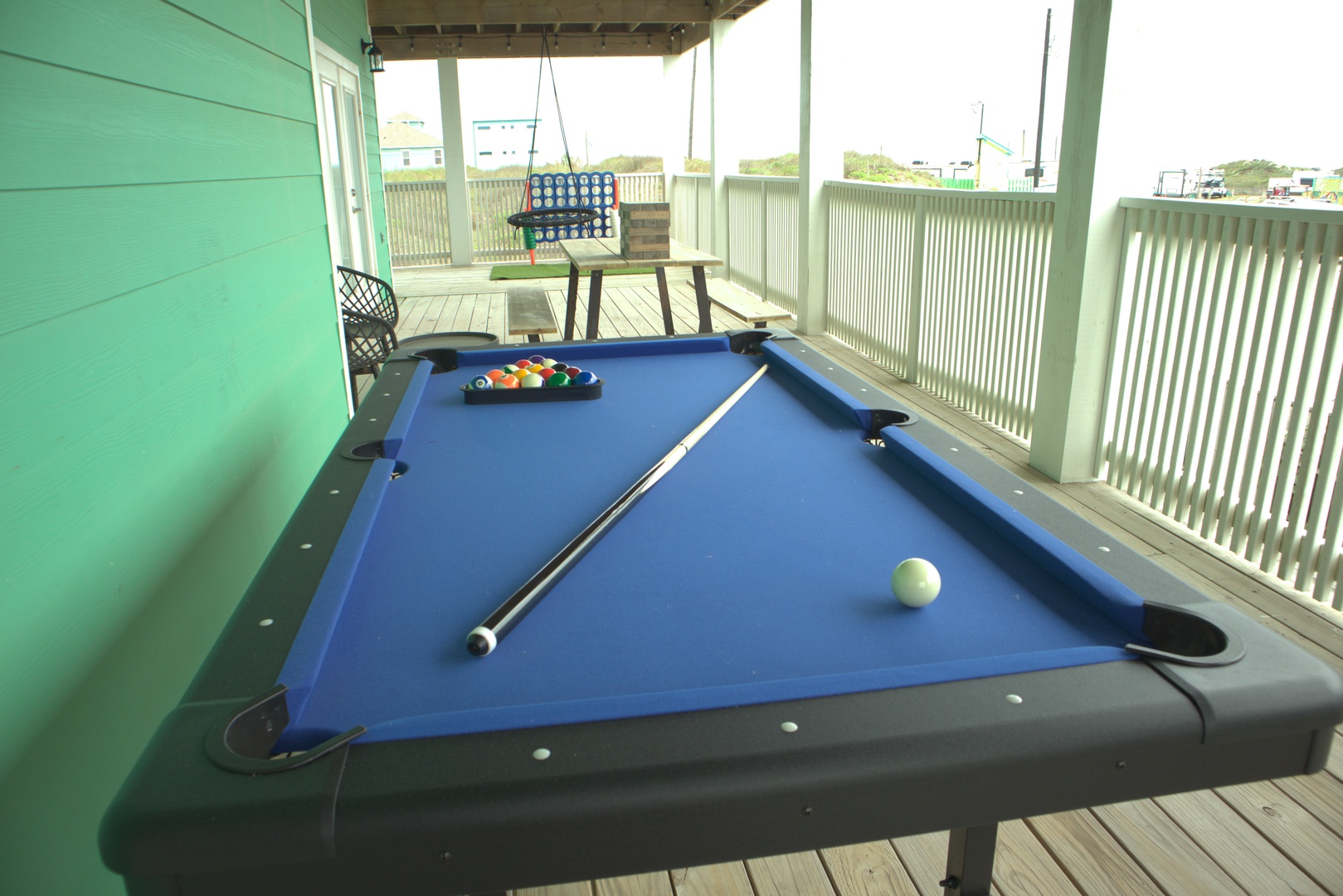 Pool and backyard games with a view of the beach