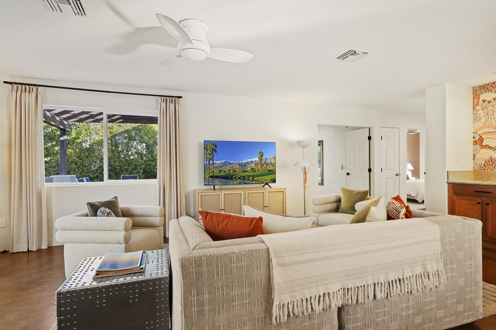 Living area with comfy seating and Smart TV