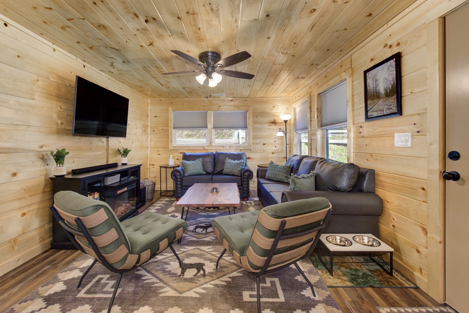 Unwind in comfort with a book or enjoy movie nights in this woodsy retreat