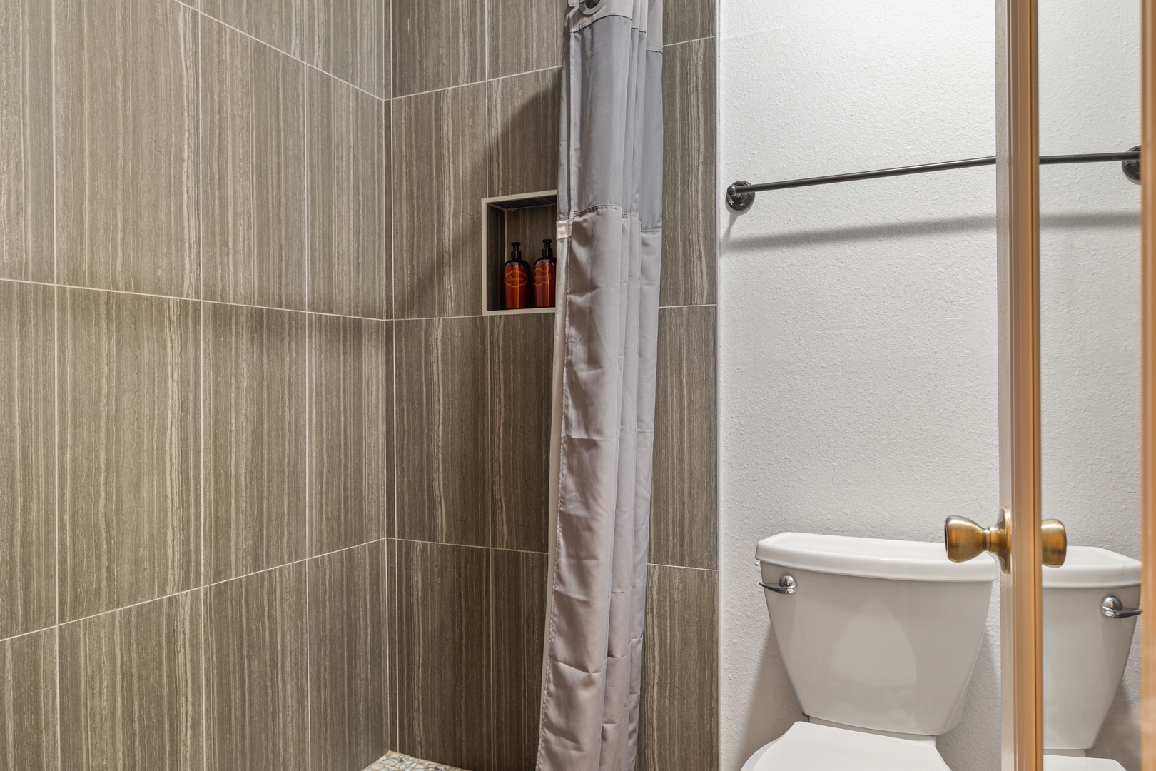 The queen en suite bathroom offers a large single vanity & walk-in shower