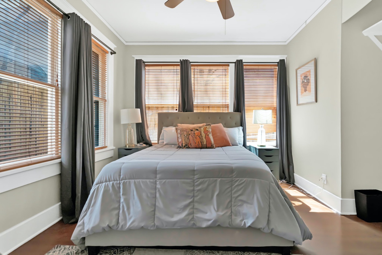 The second bedroom sanctuary offers a regal queen bed & lots of natural light