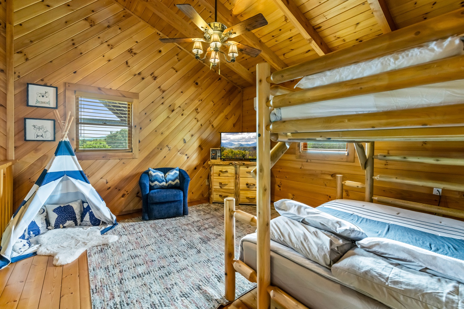 The loft features twin-over-full bunks & a cozy seating area with smart TV