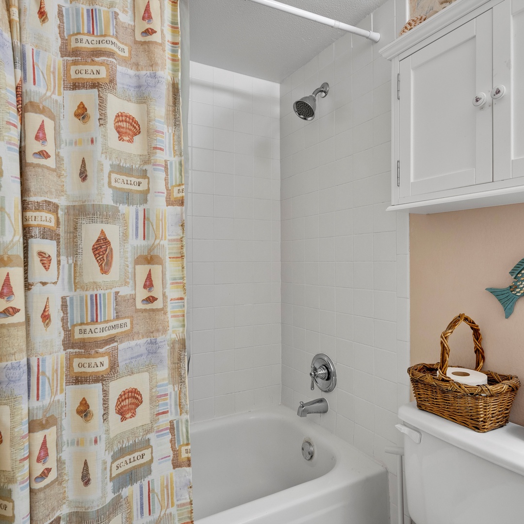Shared bathroom with shower/tub combo