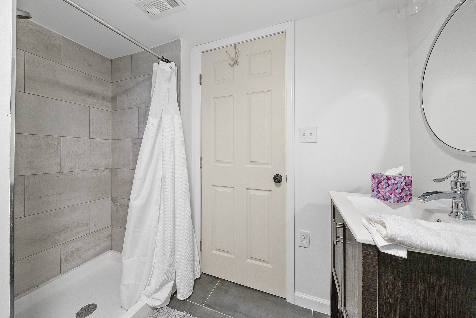 A second full bath with a walk-in shower is available in the basement