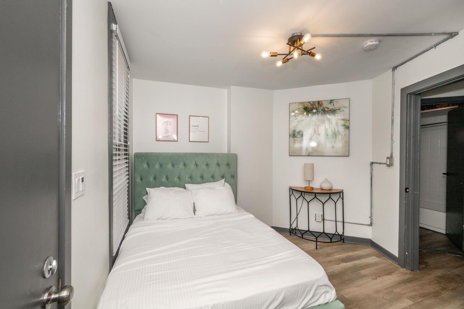 The final bedroom sanctuary on the 1st floor offers a plush full-size bed