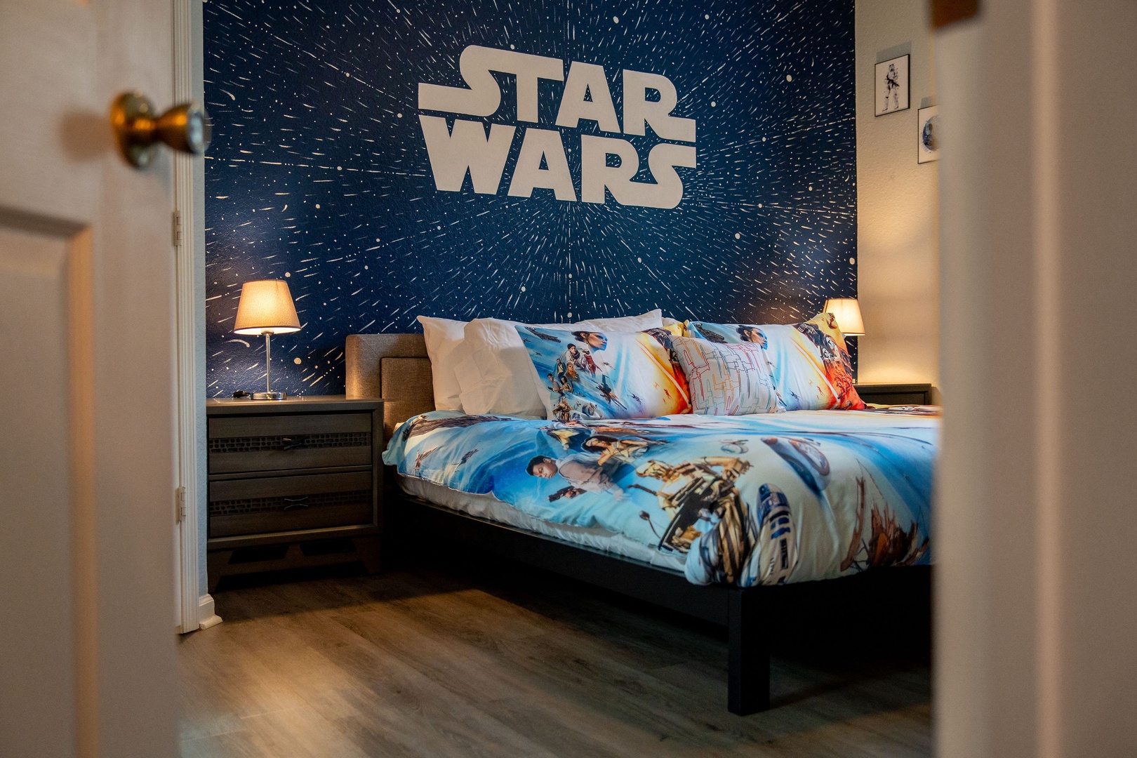 "May the Force be with you" Star Wars themed room with king bed, TV, and ensuite
