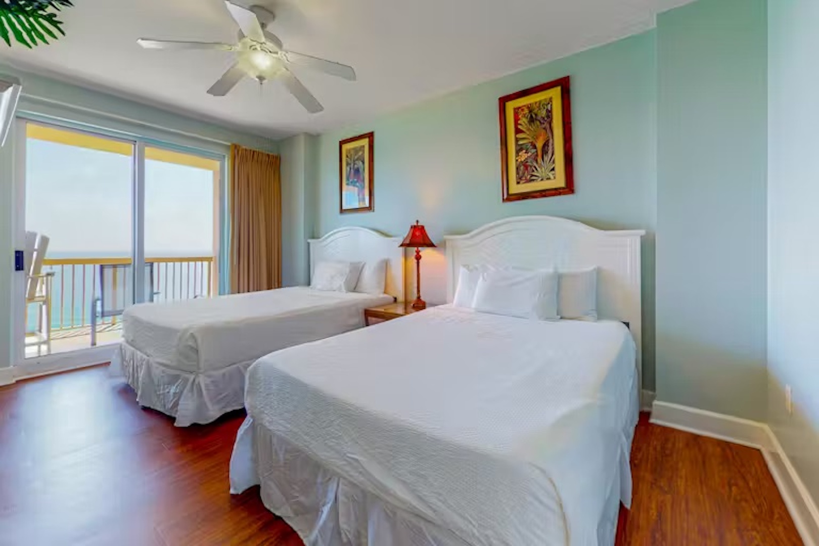 This spacious suite boasts a pair of queen beds, ensuite, & balcony access