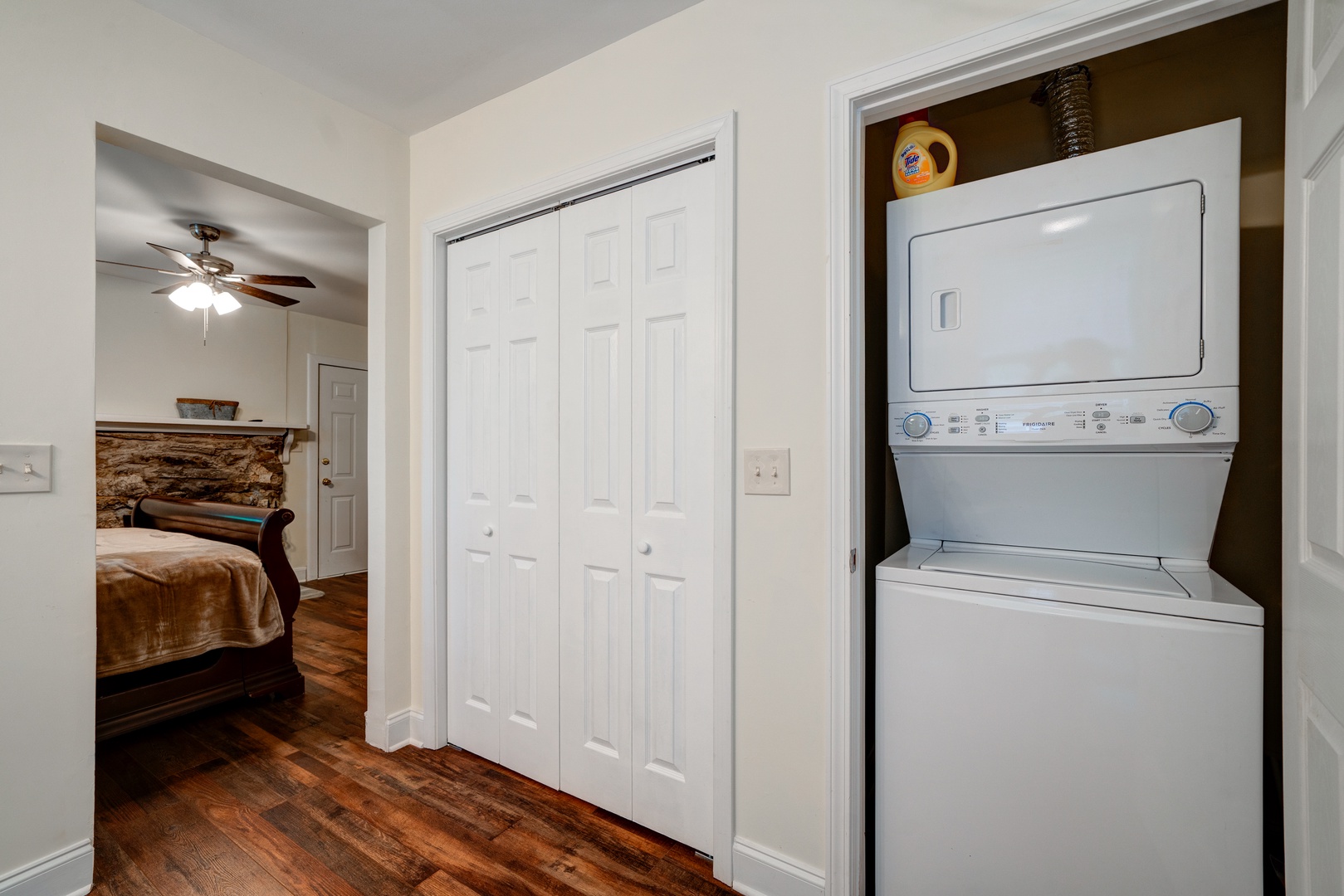 The ensuite features a large single vanity, laundry, & walk-in shower