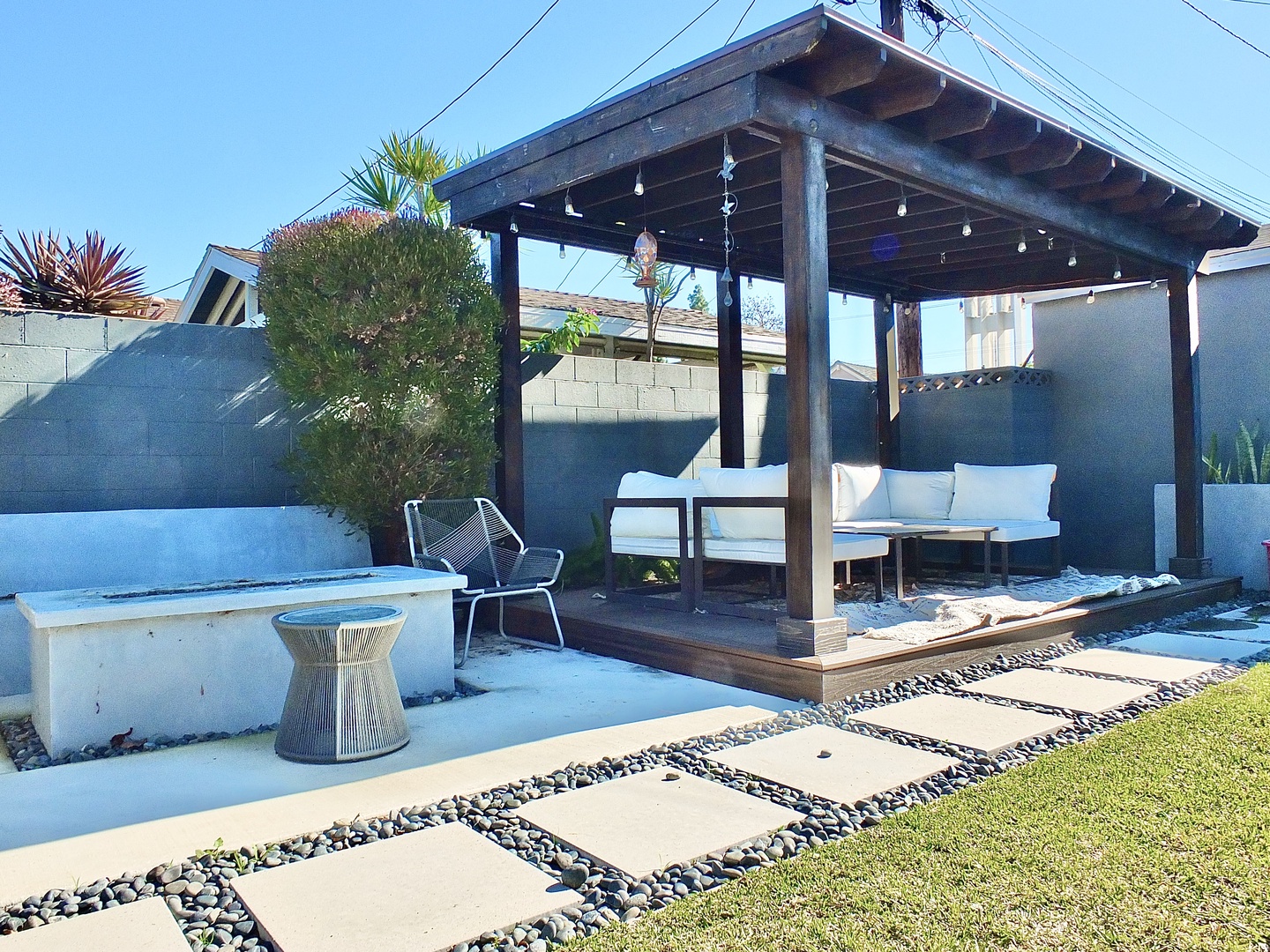 Gather around the firepit or unwind in the shade of the pergola