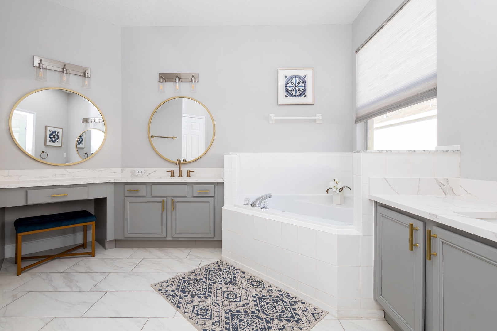 Indulge in this modern bathroom featuring a walk-in shower and a separate soaking tub