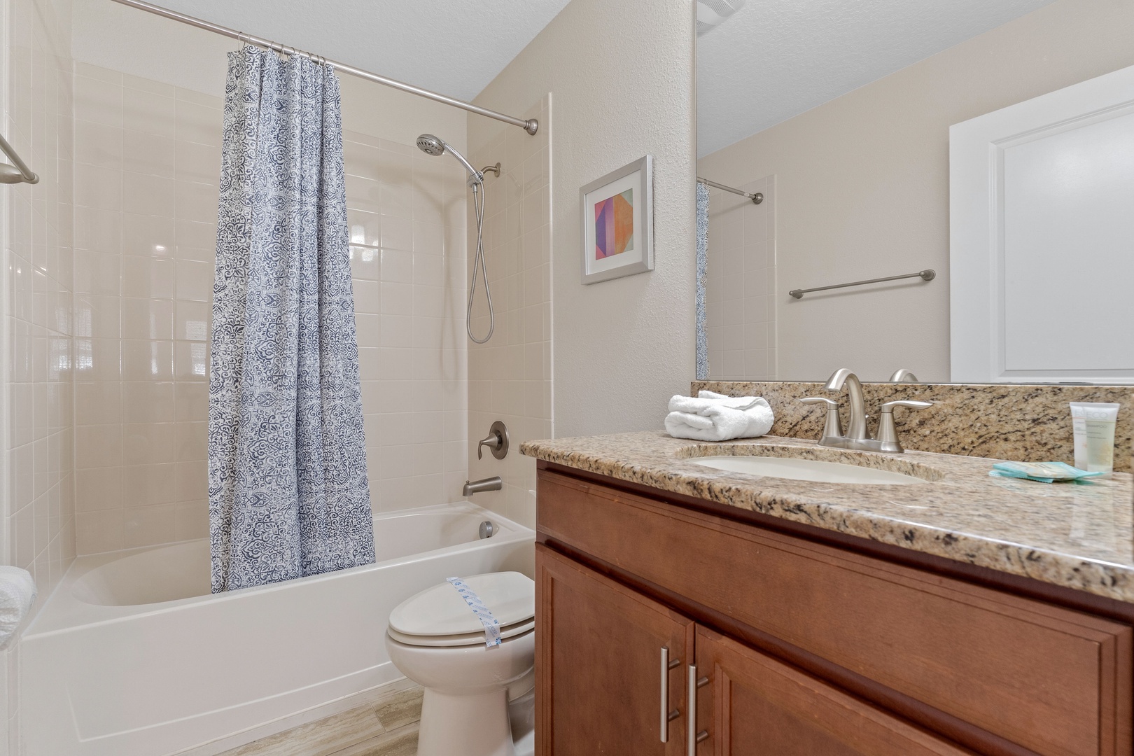 Shared bathroom with shower/tub combo