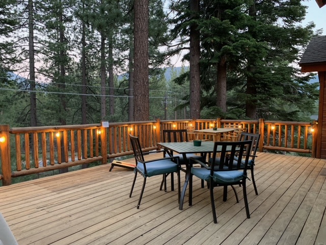 Balcony with patio furniture and string lights